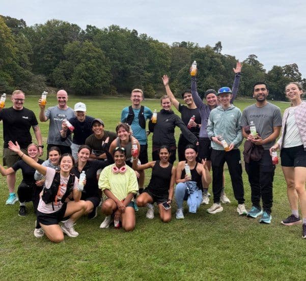A big group raising drinks after Haga parkrun